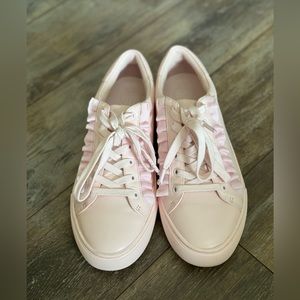 Light pink Tory Sport ruffle sneakers. Ruffle details
